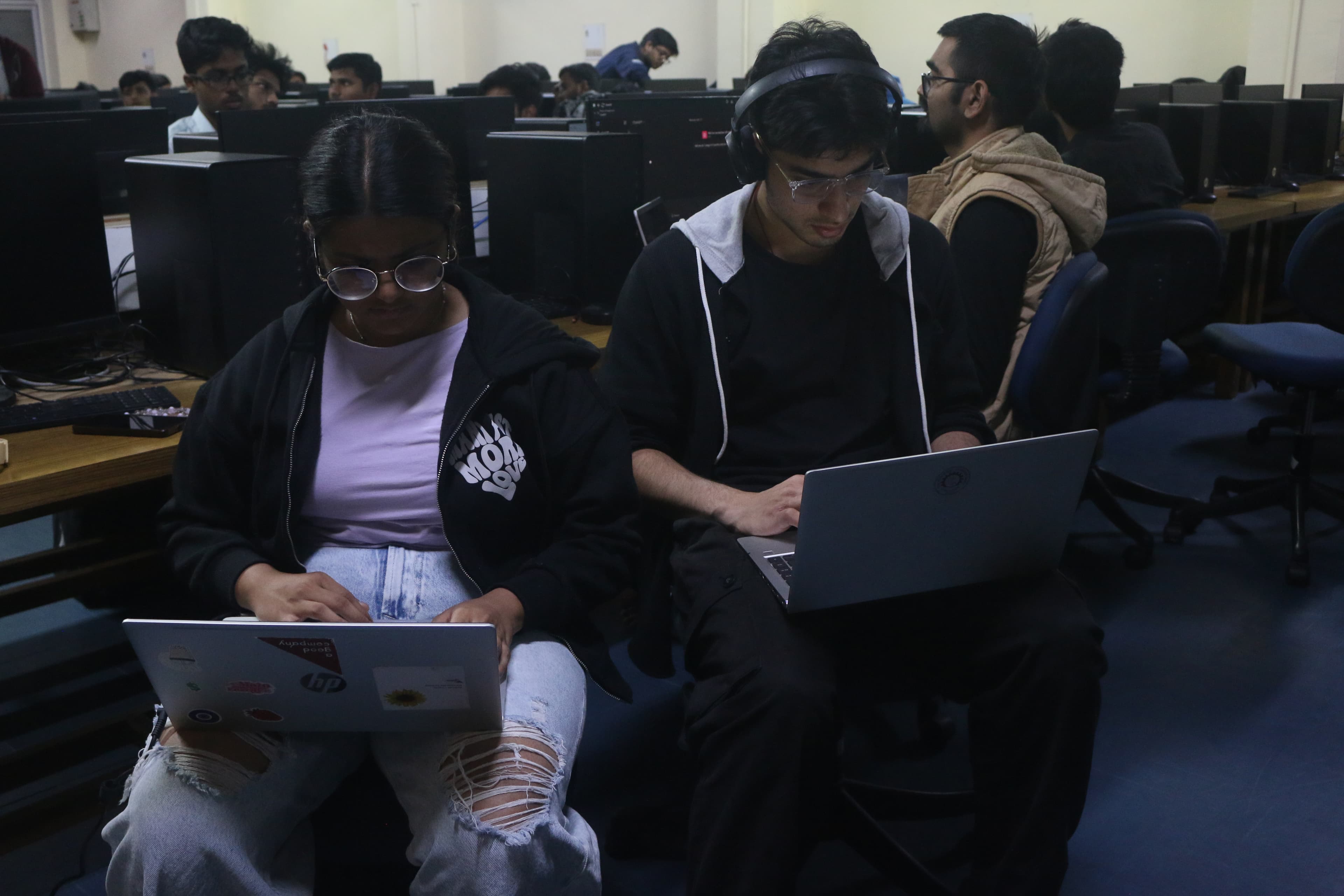 Hackathon participants coding